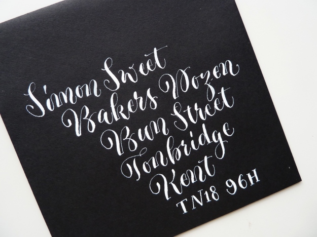 white-quirky-calligraphy-on-black-envelope-uk