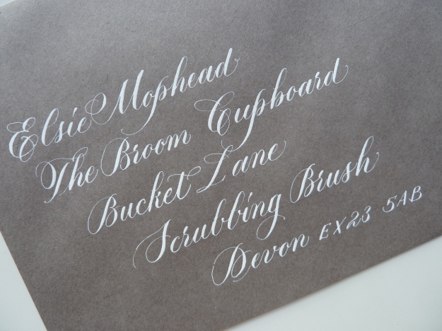 white-copperplate-calligraphy-on-grey-envelope-uk
