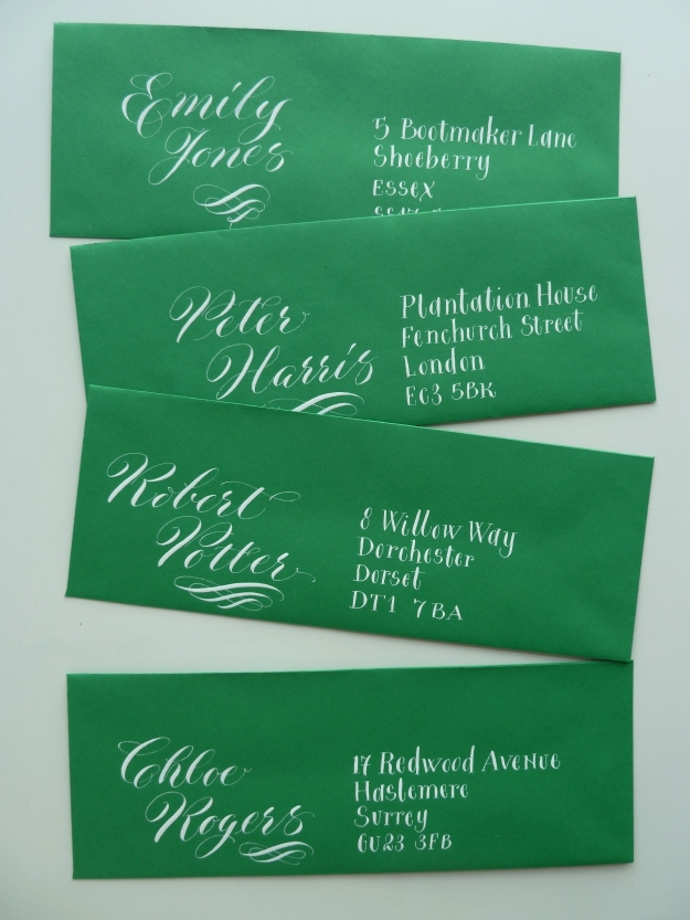 white-copperplate-calligraphy-on-green-envelopes