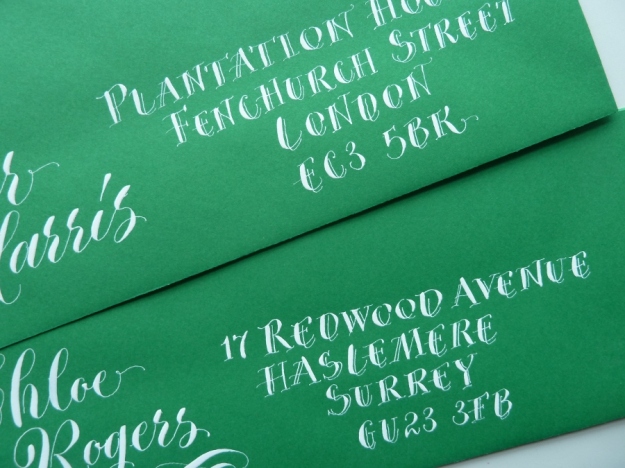 white-pointed-pen-capitals-on-green-envelope