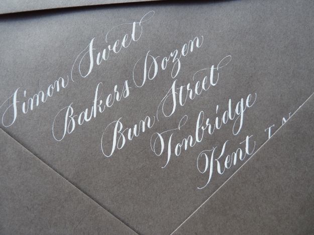 white-copperplate-calligraphy-on-gray-envelope-uk